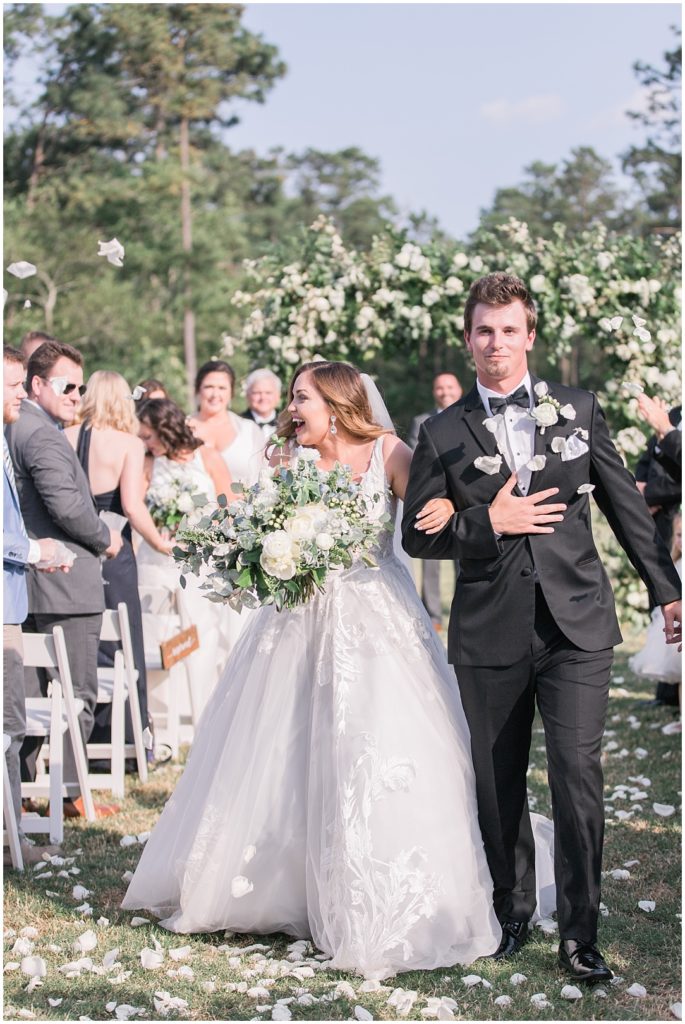 White rose petal toss down the isle is an adorable idea! | Charleston Wedding Photographer
